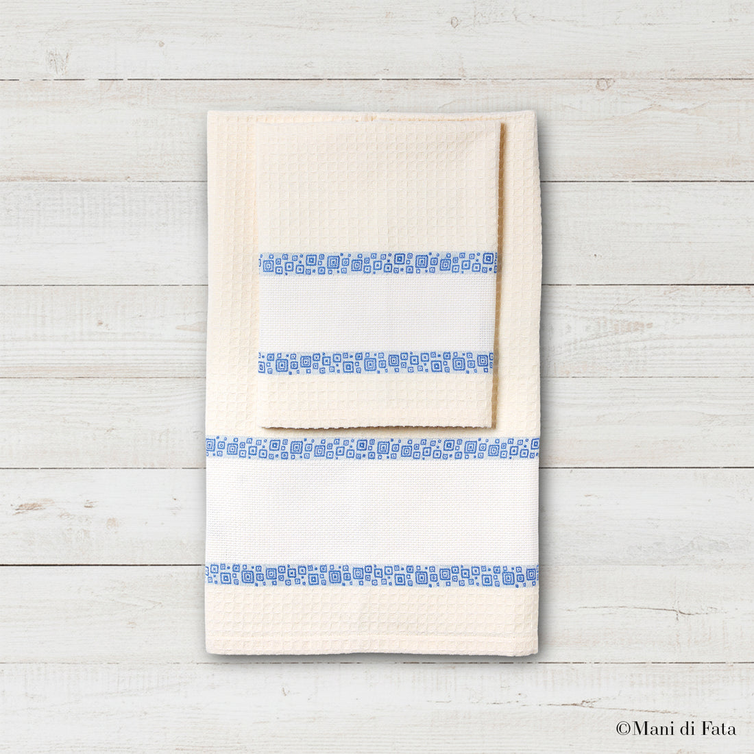 Parure nido d'ape con greca ricamo a punto croce