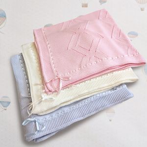 Coperta in maglia con motivo rombi